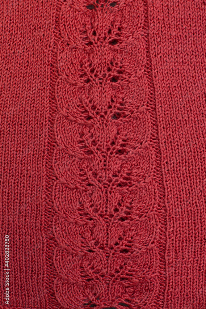 Red knitted cotton fabric, hand knit, plain knitting,  branch in  knitting needles.