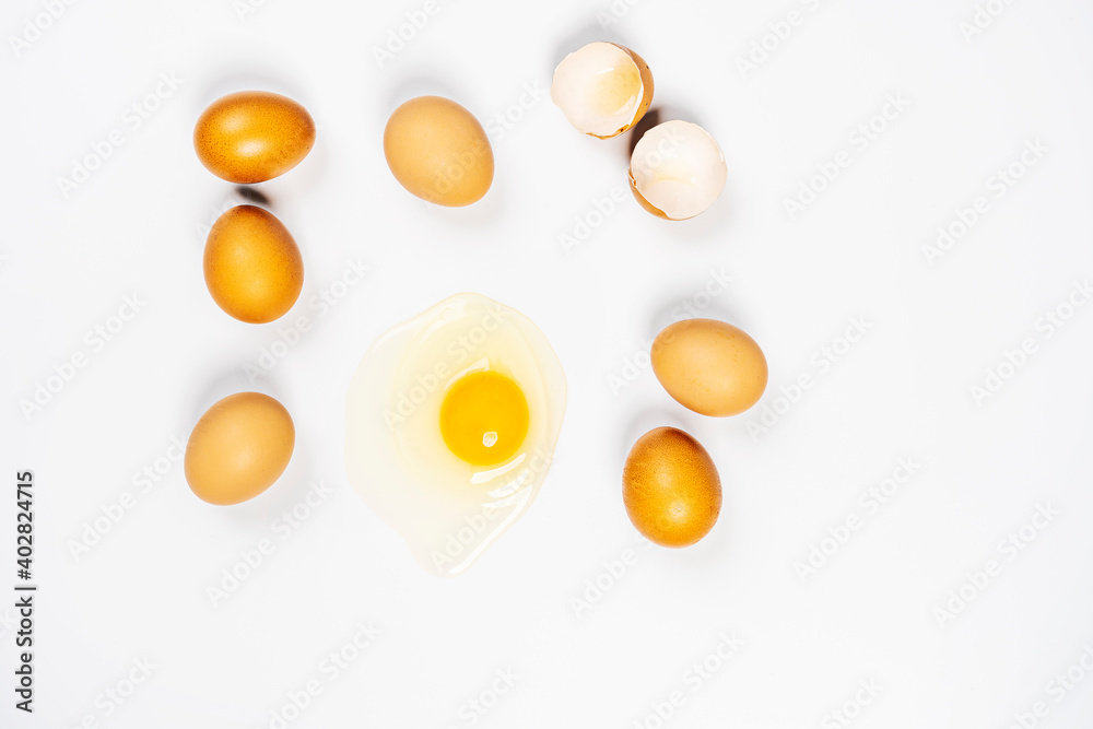fresh eggs and one broken on white background fresh eggs and one broken on white background
