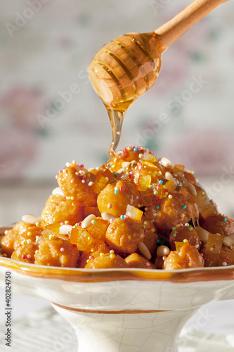 Struffoli with pinoli adn sugar granes with honey