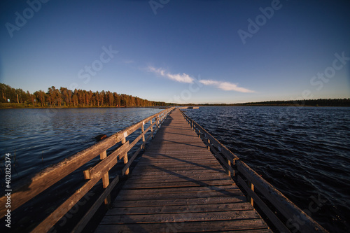 Wooden path road on lake in Finland