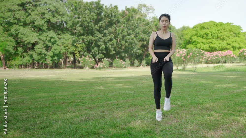 beautiful Asian woman is warming up in the park before jogging.
beautiful Asian woman is warming up in the park before jogging.