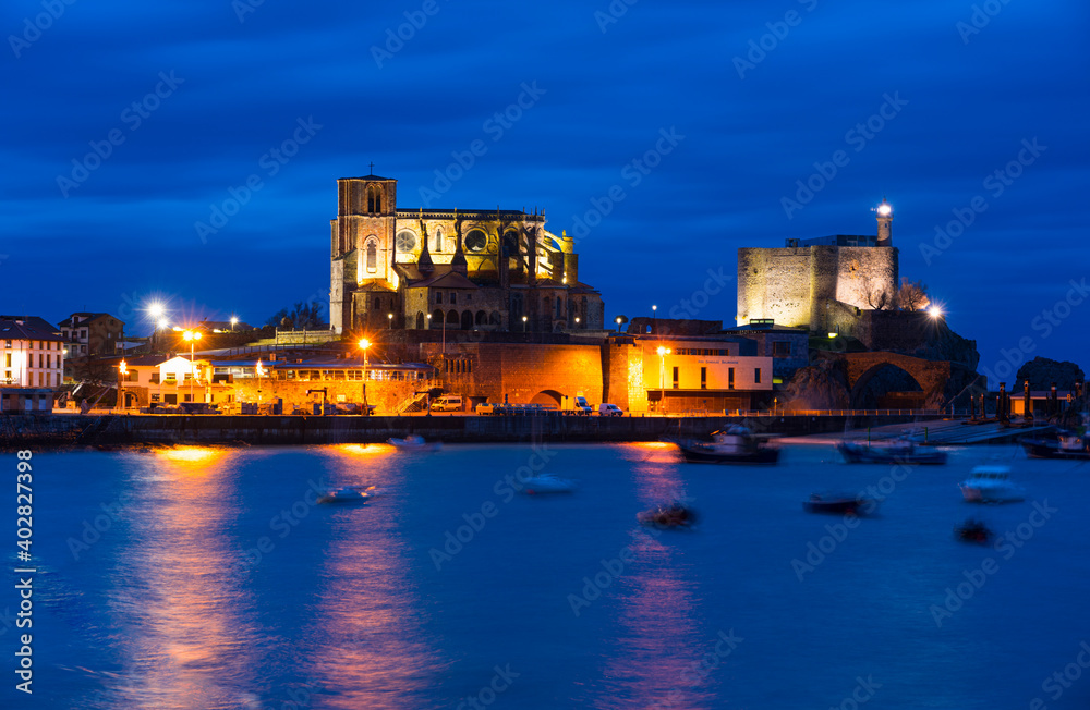 Castro Urdiales old town at dusk, with Santa Ana Church and Castillo Lighthouse, Cantabria, Spain, Europe