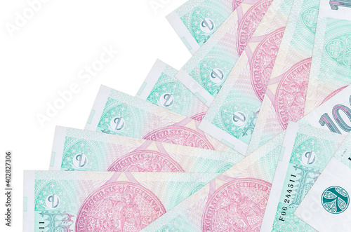 100 Czech korun bills lies in different order isolated on white. Local banking or money making concept photo