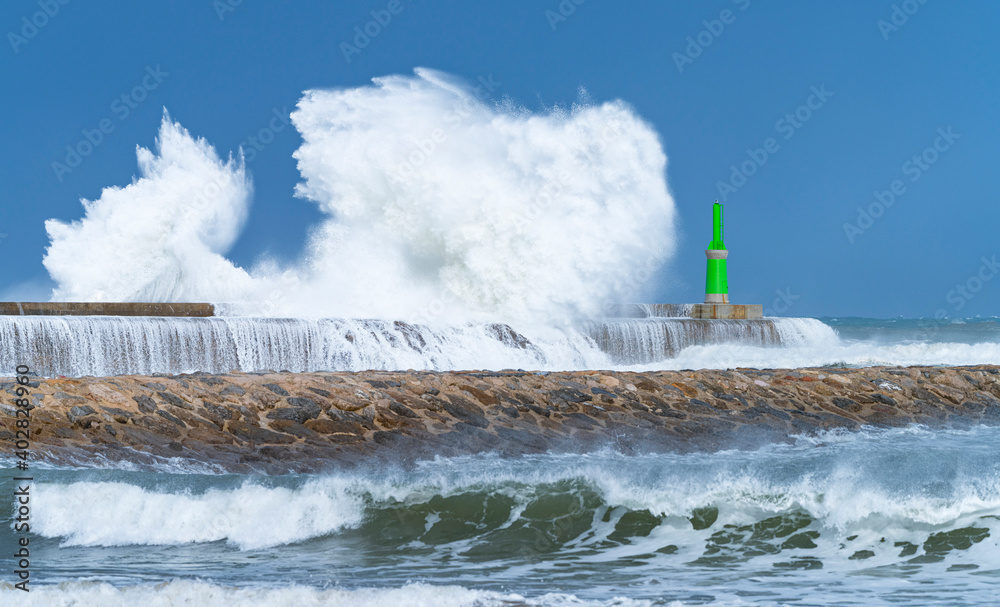 Swell in the Cantabrian Sea in the area of the Buoy Lighthouse of La Barra de San Vicente de la Barquera, at the mouth of the port. Oyambre Natural Park, Cantabria, Spain, Europe