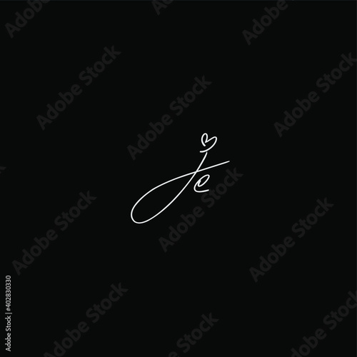 je initial handwriting black background photo