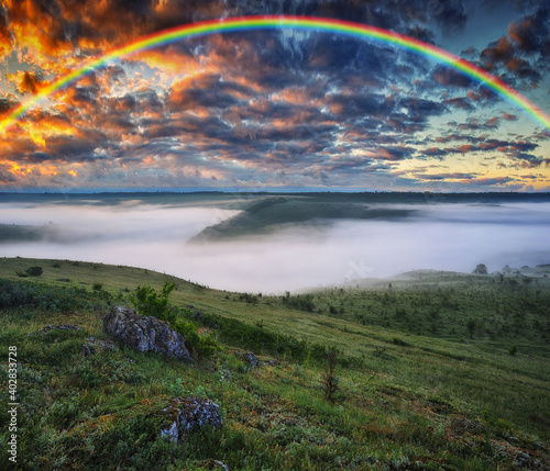 Beautiful landscape with a rainbow in the sky