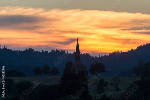 Sunset over the village Hofen in the Black Forest with the silhouette of the church © were