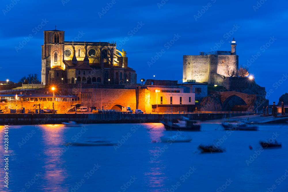 Castro Urdiales old town at dusk, with Santa Ana Church and Castillo Lighthouse, Cantabria, Spain, Europe