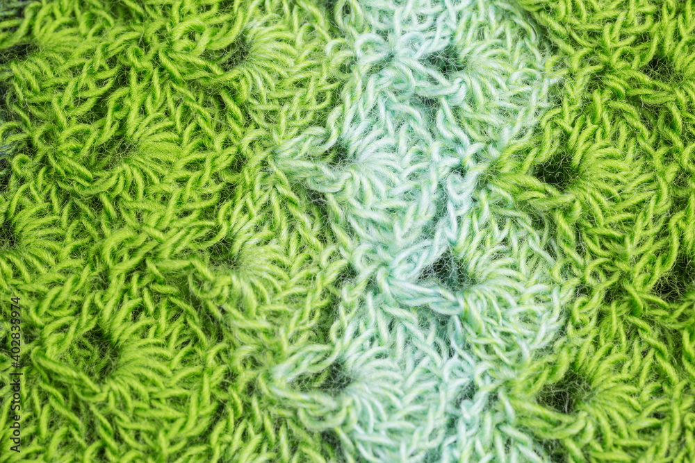 handmade multicolor crochet background in shades of green with double crochet stitches