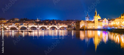 Charles Bridge and Karlovy Lazne at night lights in Prague, Czech Republic.