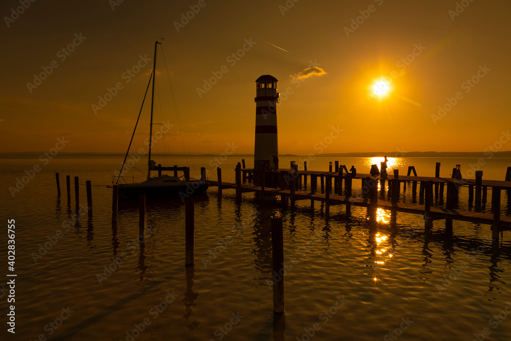 dream land scene with romantic Lighthouse on sunset, Podersdorf am see, Austria