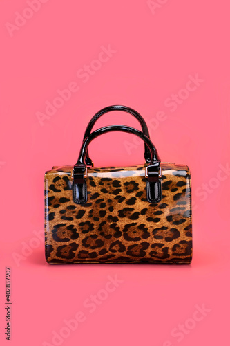 Leopard women bag on a pink background