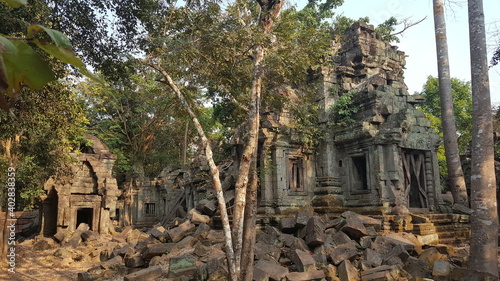 Cambodia. Banteay Ampil temple. Built in the 12th century, Banteay Ampilis a beautiful fusion of the style of art found at Angkor Wat and the overtaking of nature often seen at Ta Prohm photo