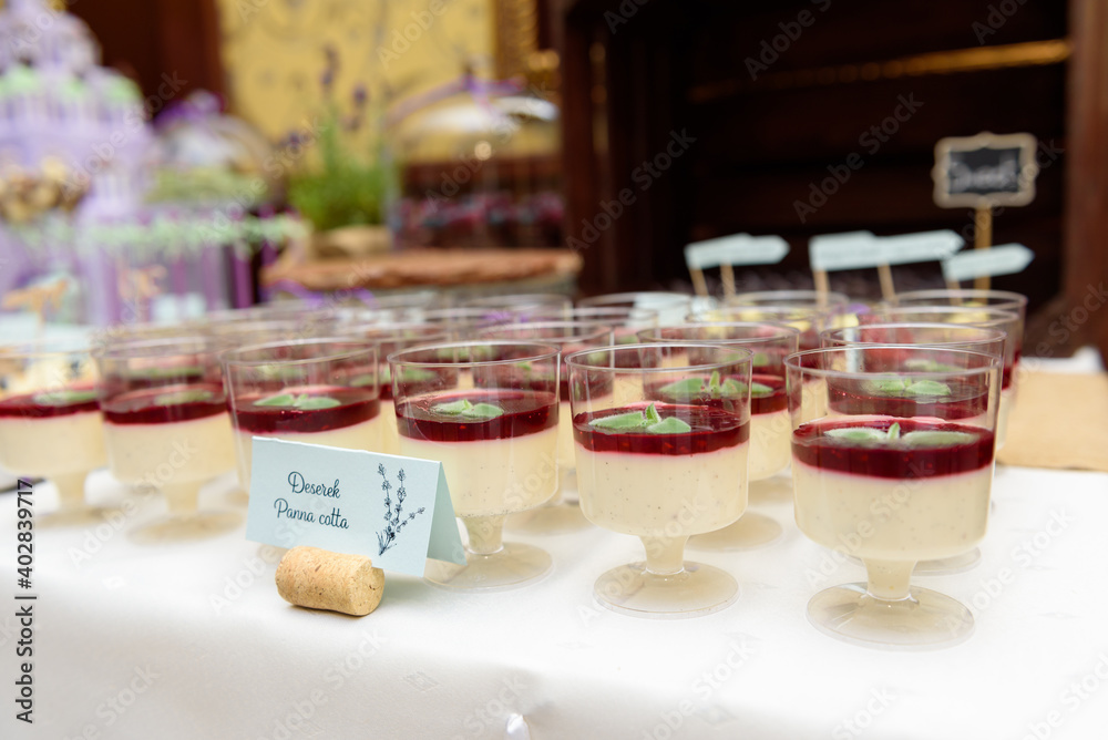 Panna cotta dessert on a rustic candy bar at the wedding party