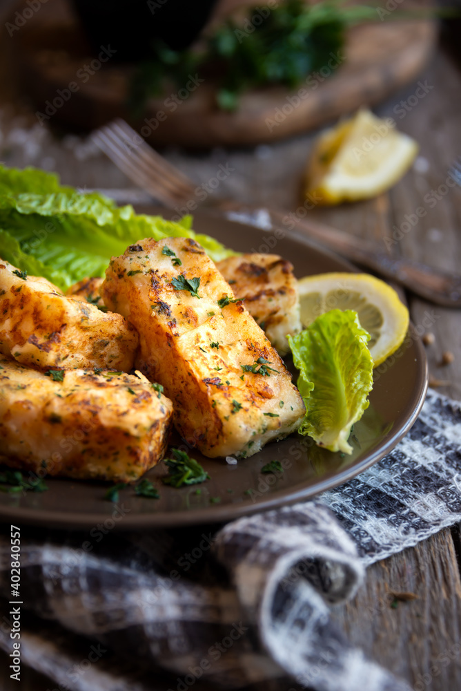 Cooked fish fillet with lemon and vegetables Cooked fish fillet with lemon and vegetables