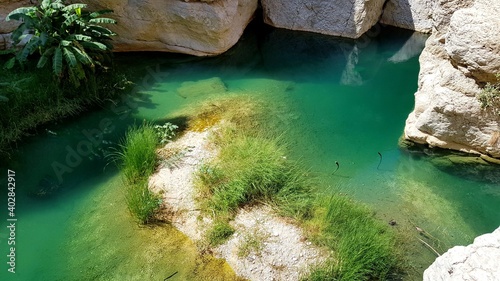 Blue-Green waterholes in Wadi Shab, Oman
