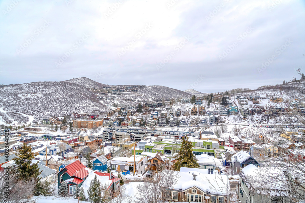 Panoramic aerial view of mountain town in the midst of a snowy winter landscape