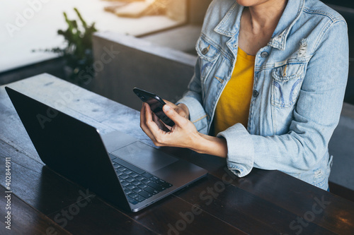 work using texting cell phone typing computer.chatting on mobile,laptop contact us at workplace Thinking investment plan Investor.searching information internet.connecting people concept