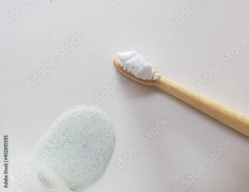 Micro plastic particles in personal care products such as toothpaste and face scrub on a white background.