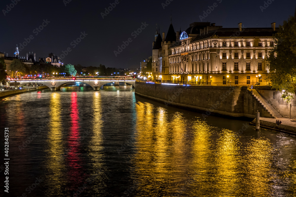 Paris, the river Seine and the Conciergerie illuminated at night