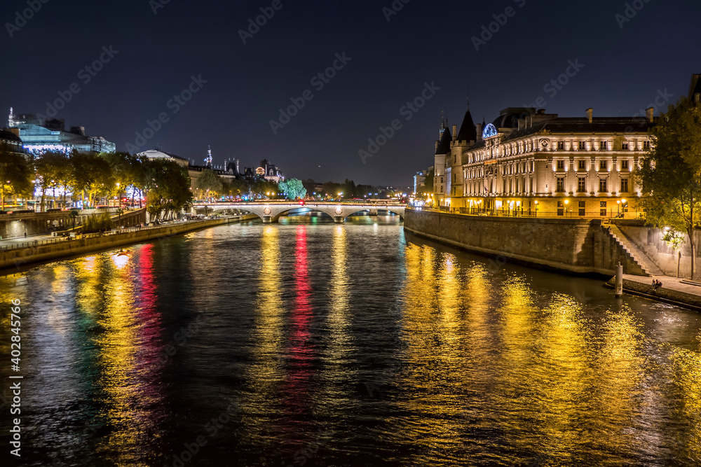 Paris, the river Seine and the Conciergerie illuminated at night