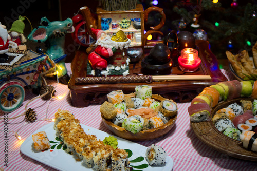 Holiday mixed set of fresh Japanese seafood sushi, rolls, nigiri and sashimi