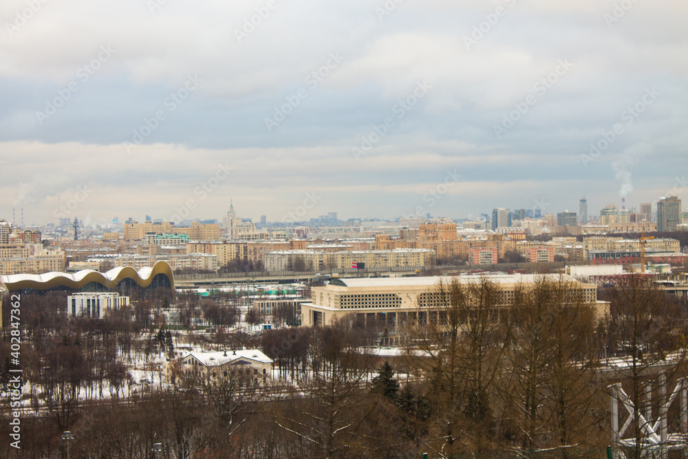 top view of the historic city center from the panoramic platform Vorobyovy Gory on a cloudy winter day and space for copying in Moscow Russia