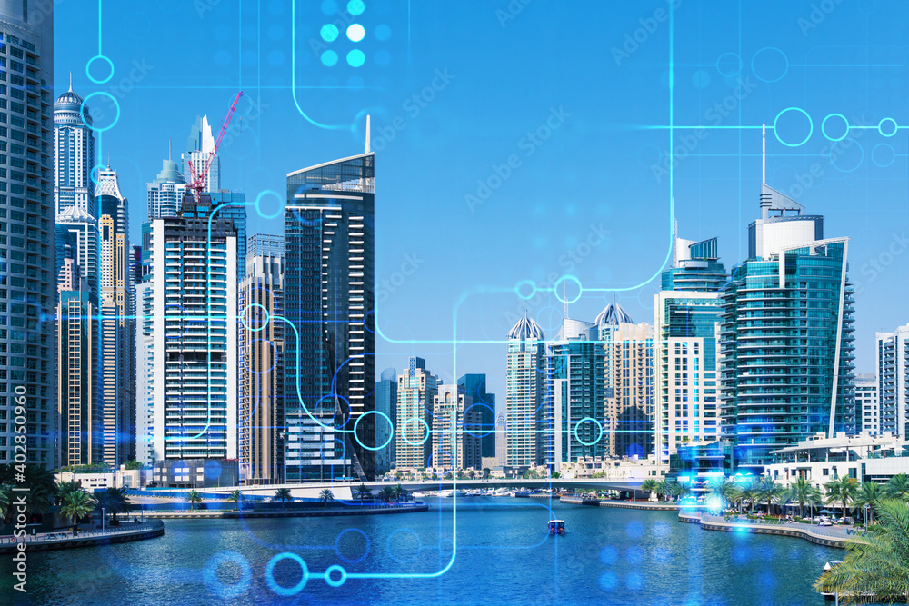 Fototapeta premium Skyscrapers of Dubai business downtown. International hub of trading and financial services. Technology theme icons hologram, concept of big data. Double exposure. Dubai Canal waterfront.