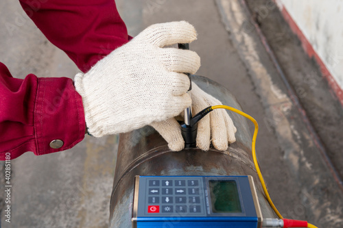 Brinell hardness testing of alloy pipe and welding after a post weld heat treatment (PWHT) photo