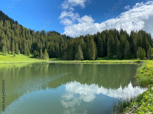 The alpine lake Seeblisee at the foot of the mountain range First and in the Schwyz Alps mountain massif, Oberiberg - Canton of Schwyz, Switzerland (Kanton Schwyz, Schweiz) photo