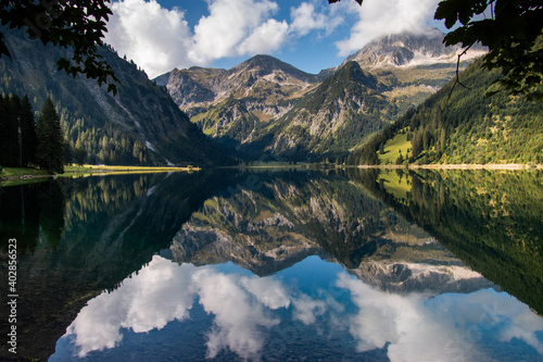Fototapeta Naklejka Na Ścianę i Meble -  
The Vilsalpsee in the morning in the nature reserve of the Tannheimer Valley in Tyrol / Austria