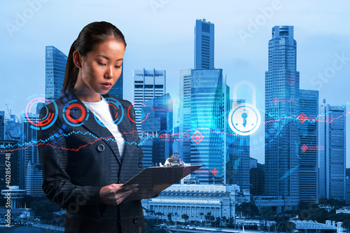 Photography Attractive Asian cybersecurity developer explores her notes from day planner to protect clients confidential information