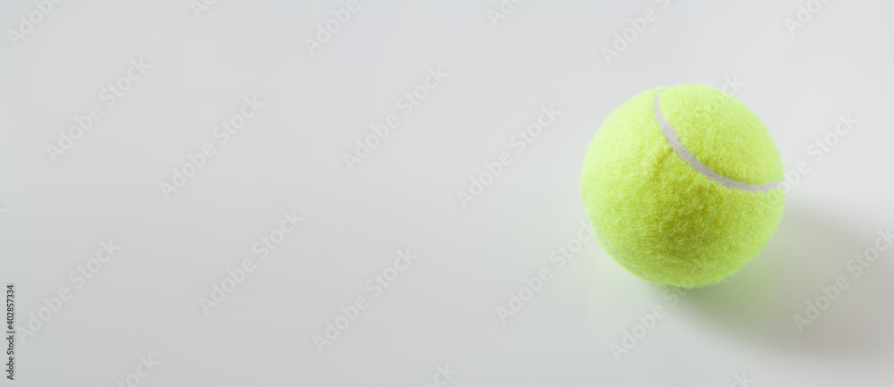  Tennis ball on the grey background. Space for your text
