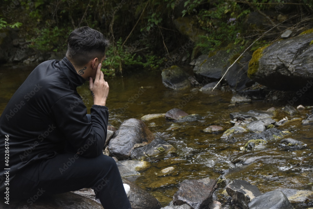 person sitting on the rocks 