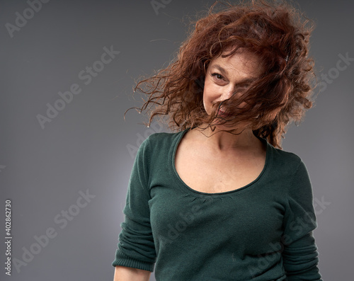 Senior woman on gray background photo