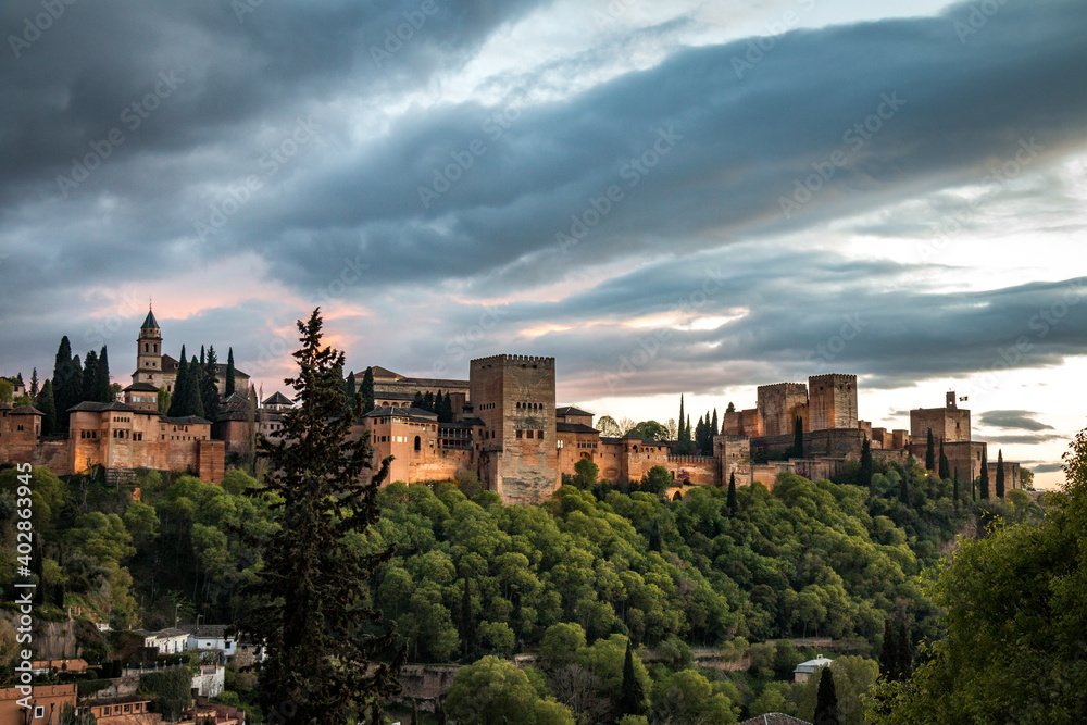 city palace of alhambra at night, granada, spain