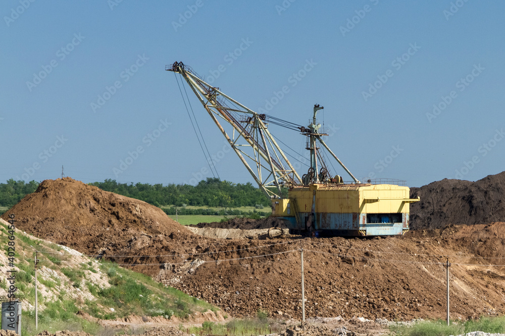 Walking excavator in a clay quarry