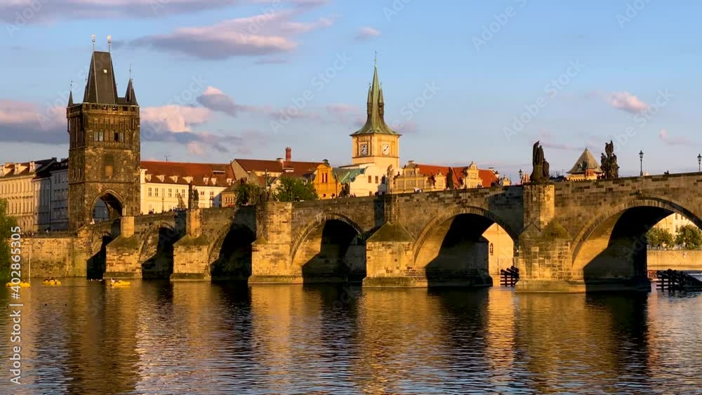 Scenic view of the Old Town pier architecture and Charles Bridge over Vltava river in Prague, Czech Republic. Prague iconic Charles Bridge (Karluv Most) and Old Town Bridge Tower at sunset, Czechia. Scenic view of the Old Town pier architecture and Charles Bridge over Vltava river in Prague, Czech Republic. Prague iconic Charles Bridge (Karluv Most) and Old Town Bridge Tower at sunset, Czechia.