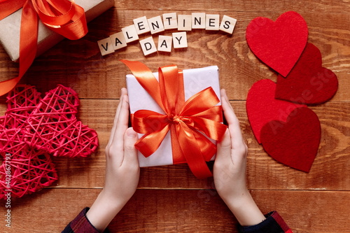 The child gives Mother's Day or Valentine's Day gift. Project of children's creativity, handicrafts, crafts for kids.