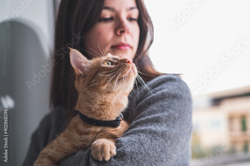 Pretty woman holding a cat