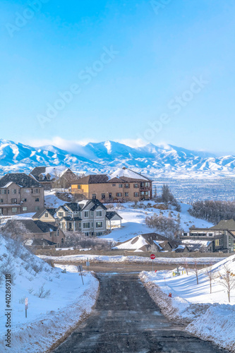Scenic snowy landscape of neighborhood overlooking Utah Valley and mountain