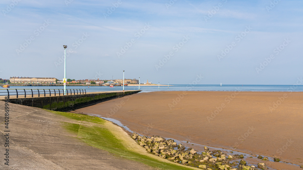 The ferry pier in Knott End-on-Sea, Lancashire, England, UK - with the River Wyre and Fleetwood in the background