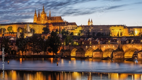 Charles Bridge over the Vltava River in Prague with castle in the background.