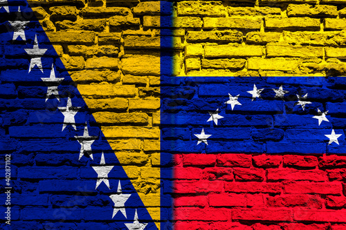 Flag of Bosnia and Venezuela on brick wall