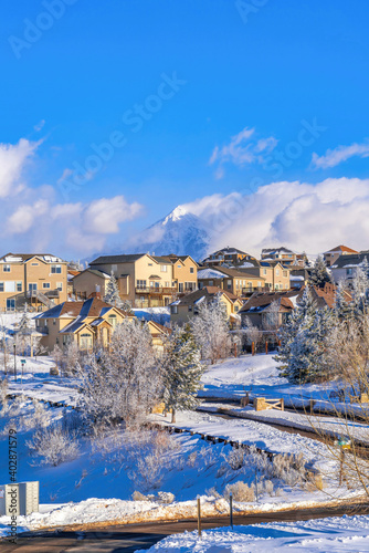 Homes in luxurious neighborhood in Highland Utah with cloudy blue sky background