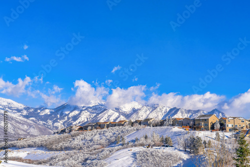 Spectacular views in Highland Utah with houses nestled on snowy mountain slope