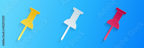 Paper cut Push pin icon isolated on blue background. Thumbtacks sign. Paper art style. Vector.