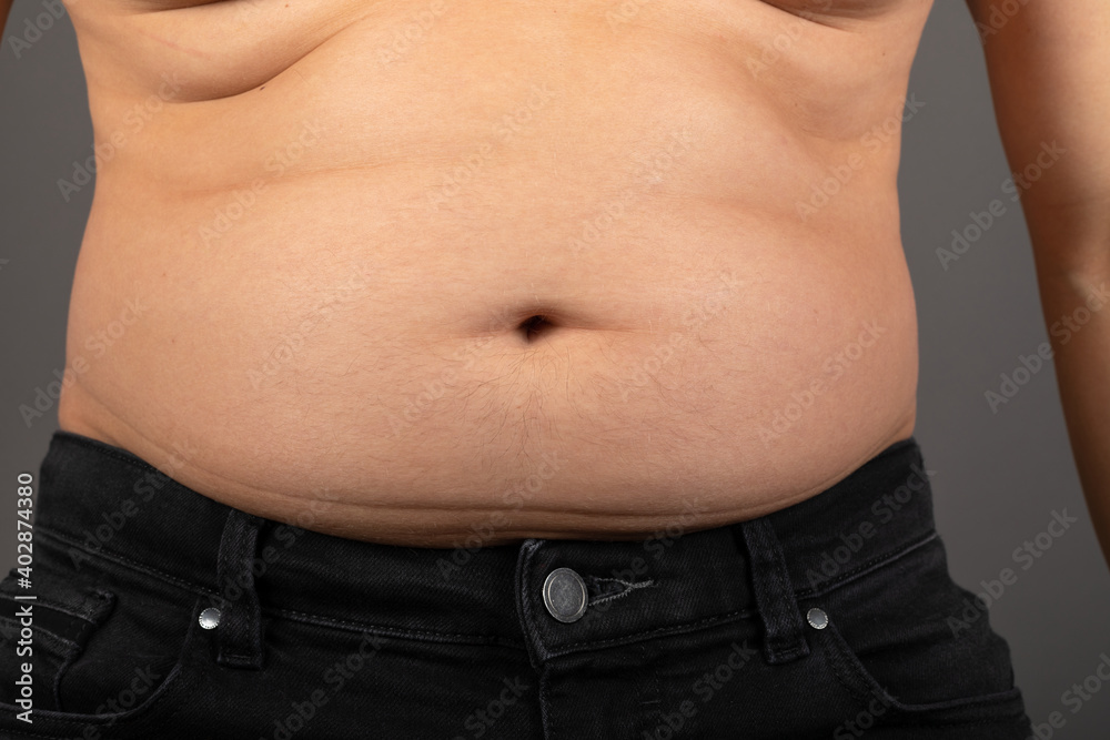 Naklejka premium Bloated stomach close up