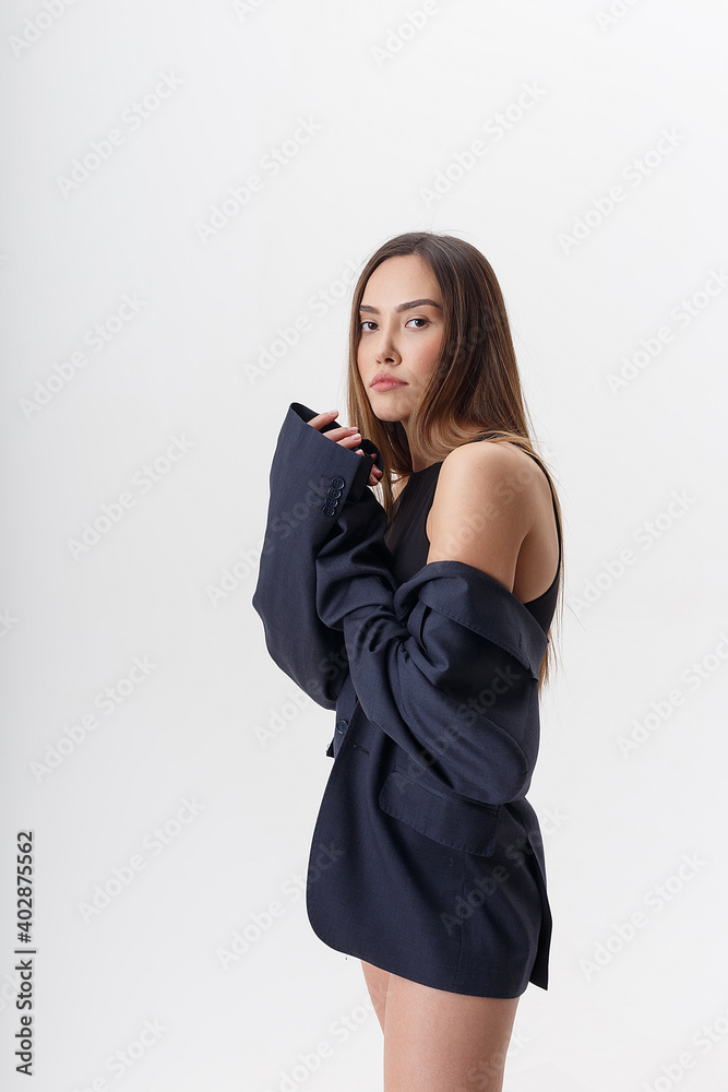 portrait of young attractive asian woman with long hair in black bodysuit and blue suit isolated on white studio background. skinny pretty female posing on cyclorama. model tests of beautiful lady portrait of young attractive asian woman with long hair in black bodysuit and blue suit isolated on white studio background. skinny pretty female posing on cyclorama. model tests of beautiful lady
