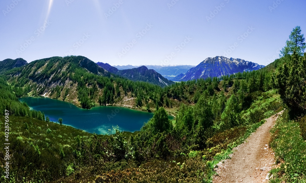 glittering water from a wonderful blue mountain lake panorama